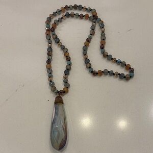 Elegant Beaded Necklace with Teardrop Pendant